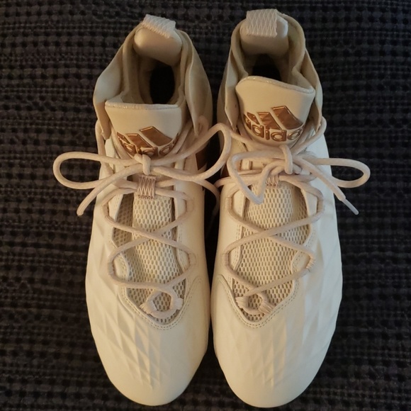 white and gold lacrosse cleats